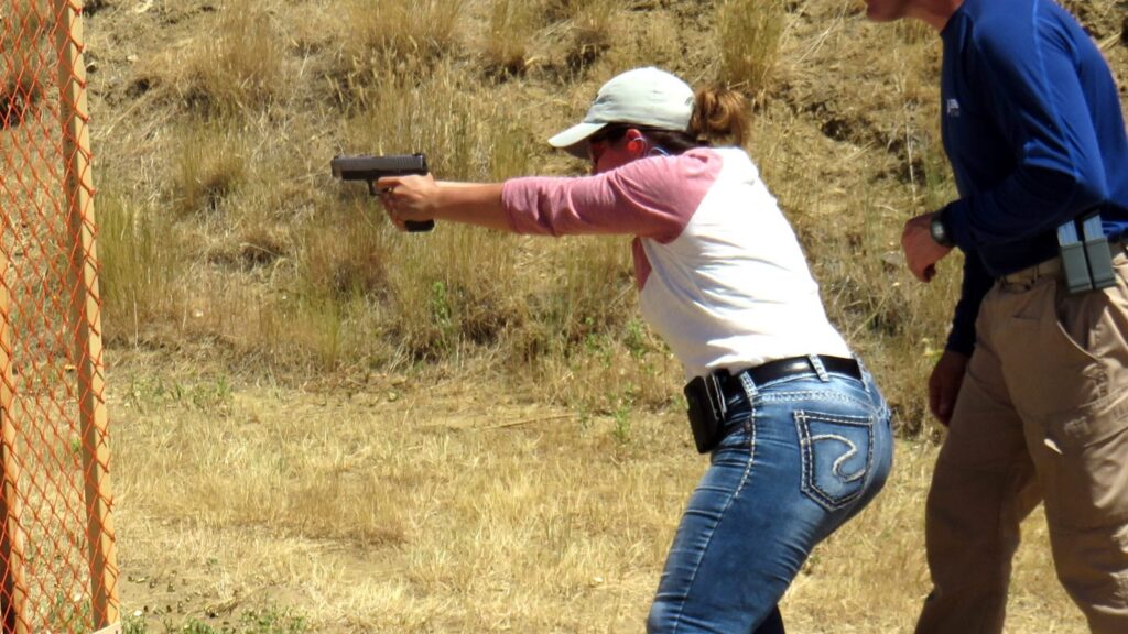 Live Fire Stance Woman - LTC Classes Online - Texas Concealed Handgun License-Texas license to carry rules-Texas license to carry regulations